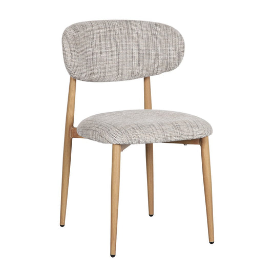 Twee beige Pole To Pole Japandi eetkamerstoelen Droogte met een metalen frame, staand aan een houten eettafel in een minimalistisch interieur.
