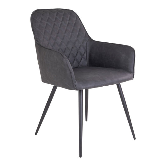 Set van 2 grijze Harbo eetkamerstoelen van House Nordic, gemaakt van PU-leer en zwart staal, staand aan een moderne eettafel.