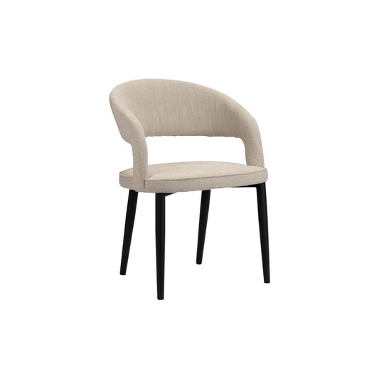 Set van twee Pole To Pole Tusk eetkamerstoelen in beige stof met zwarte gepoedercoate metalen poten, in een moderne interieuromgeving.