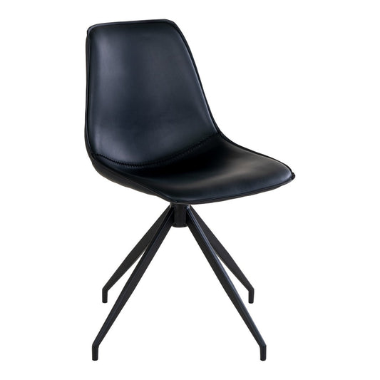 Set van twee zwarte House Nordic Monaco eetkamerstoelen met PU-leren zitting en stalen poten, staand aan een eettafel