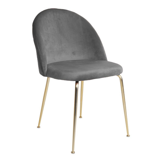 Set van twee House Nordic Geneve eetkamerstoelen in grijs fluweel met slanke messingkleurige poten, staand aan een eettafel.
